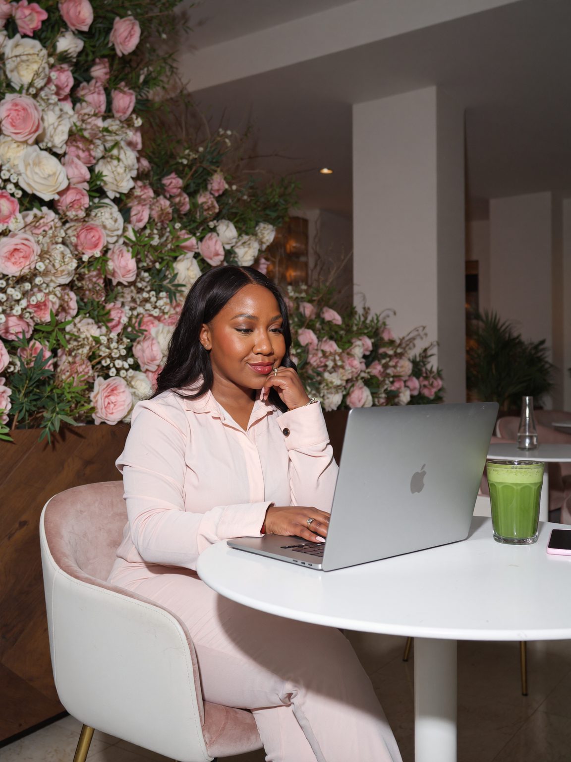 Rochelle Be working on her laptop